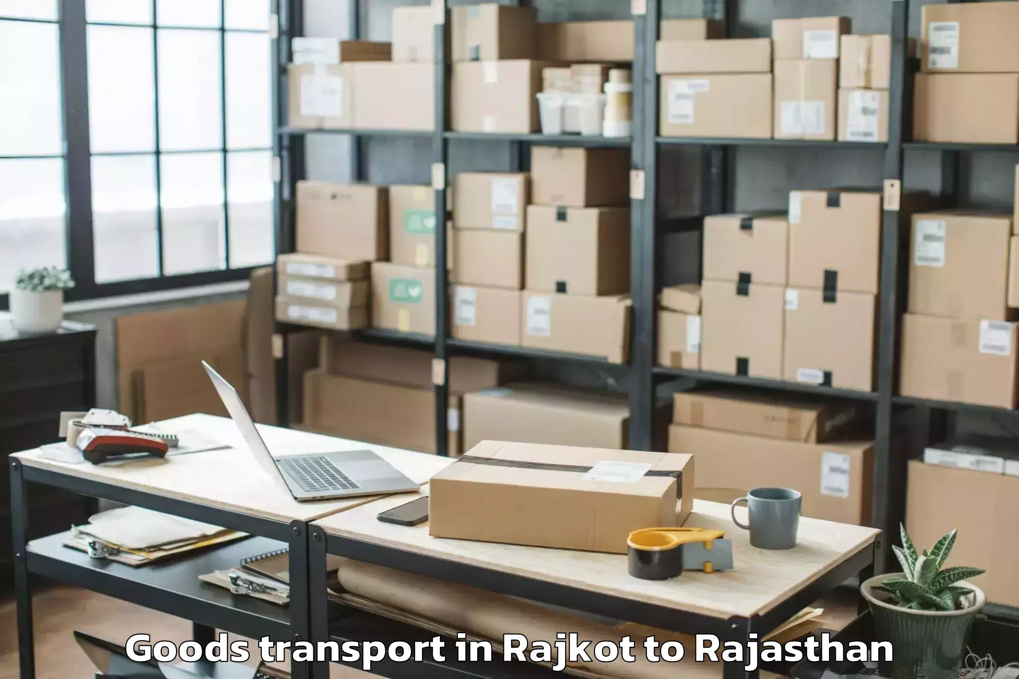 Professional Rajkot to Salumbar Goods Transport